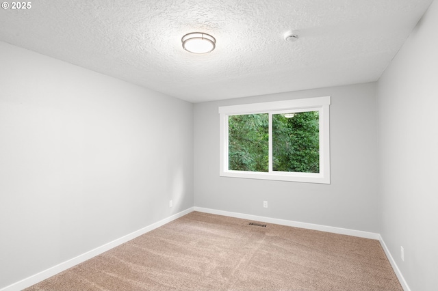 18240 SW Jay St, Beaverton, OR 97003 - empty room featuring a textured ceiling, carpet flooring, and a smoke detector