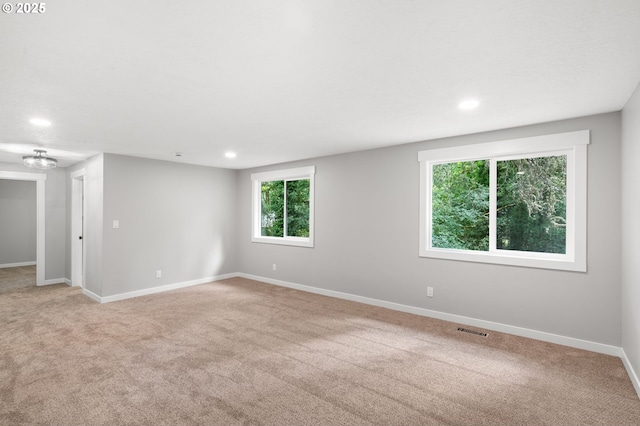 18240 SW Jay St, Beaverton, OR 97003 - empty room with light carpet, recessed lighting, and a chandelier