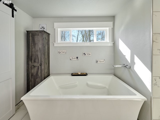 full bathroom with a freestanding bath