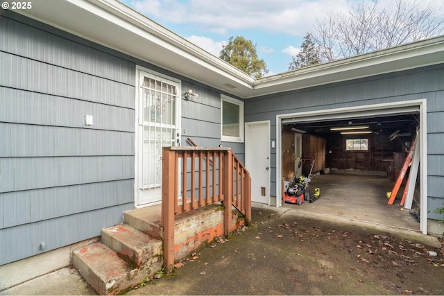 view of exterior entry featuring a garage