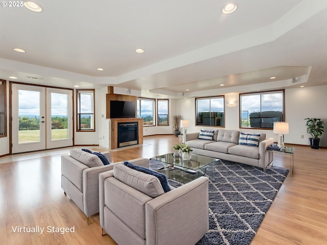 2221 NW 206th St, Ridgefield, WA 98642 - living room with light wood-type flooring, a fireplace with flush hearth, and recessed lighting