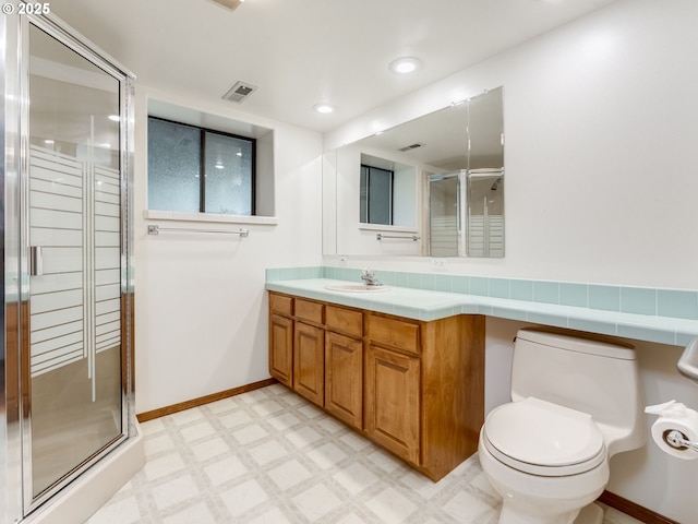 2221 NW 206th St, Ridgefield, WA 98642 - full bath featuring a shower stall, vanity, tile patterned floors, and recessed lighting
