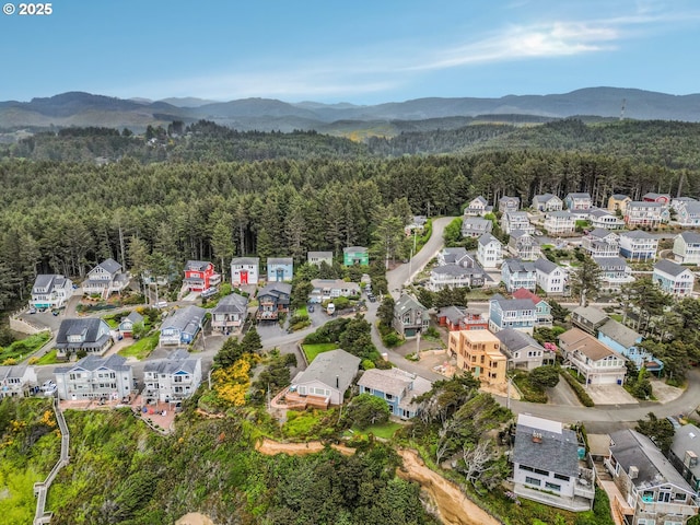 727 SW Bard Rd, Lincoln City, OR 97367 - aerial view of property's location with a forest and a mountain backdrop