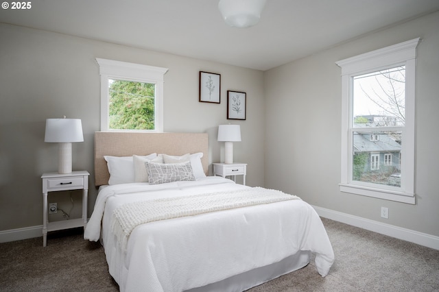 bedroom with carpet flooring and baseboards