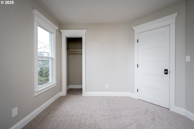 unfurnished bedroom with baseboards and carpet floors