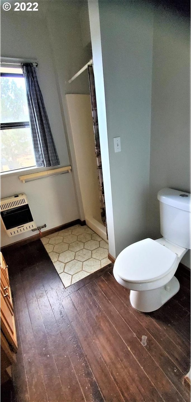 bathroom featuring toilet and hardwood / wood-style floors