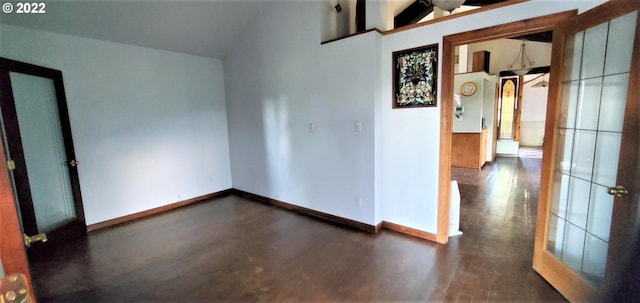 spare room featuring lofted ceiling