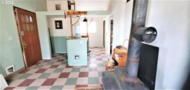 hallway with dark tile floors