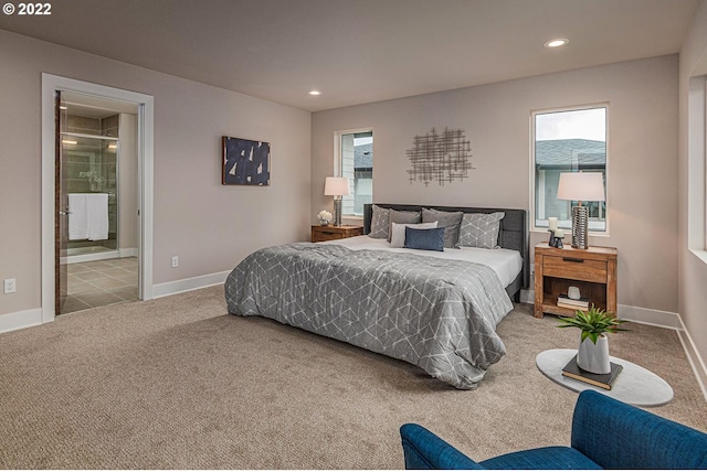 tiled bedroom featuring connected bathroom