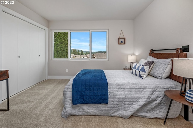 carpeted bedroom with a closet