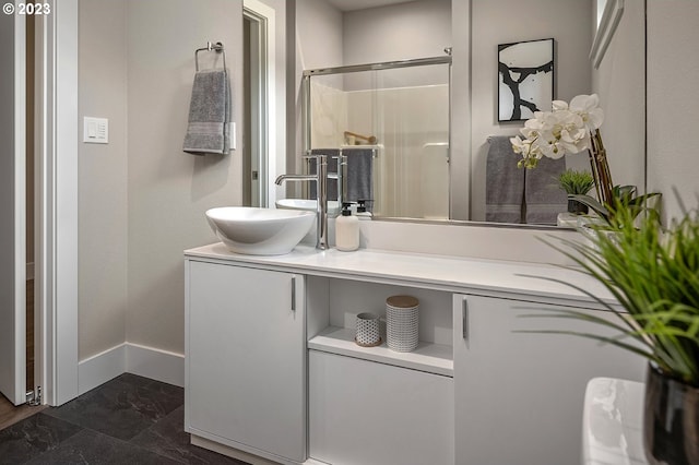 bathroom featuring walk in shower, tile flooring, and large vanity