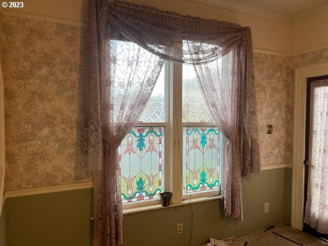 interior space with crown molding