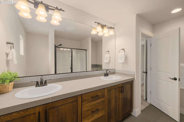 13193 SW Aubergine Ter, Sherwood, OR 97140 - full bathroom with double vanity, tile patterned flooring, and a stall shower