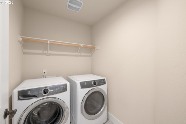 13193 SW Aubergine Ter, Sherwood, OR 97140 - laundry area with washing machine and clothes dryer and baseboards