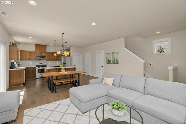 13193 SW Aubergine Ter, Sherwood, OR 97140 - living area with dark wood finished floors and recessed lighting