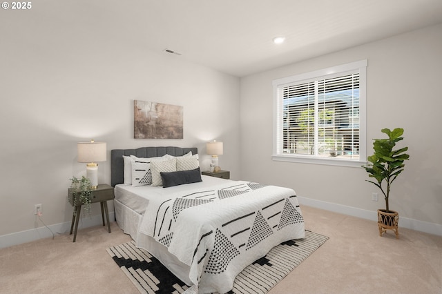 bedroom featuring baseboards, carpet flooring, and visible vents
