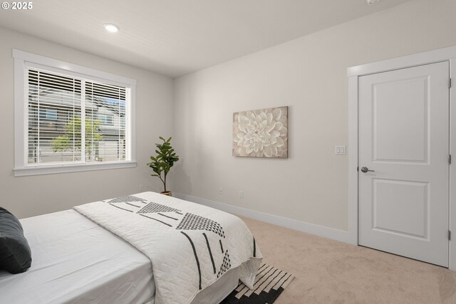 bedroom with recessed lighting, carpet, and baseboards