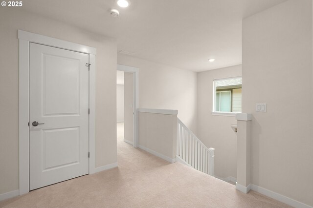 carpeted empty room featuring recessed lighting and baseboards