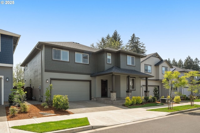 prairie-style house featuring driveway and a garage