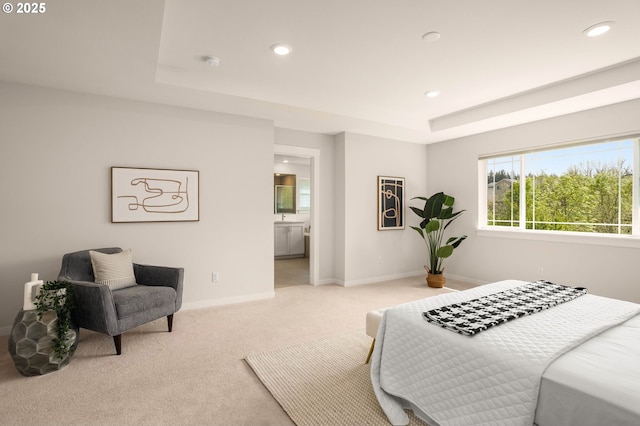 bedroom with a tray ceiling, baseboards, carpet flooring, and recessed lighting