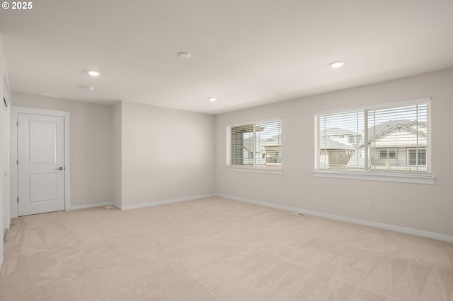 16648 SW Colorado Ln, Tigard, OR 97224 - empty room with light colored carpet, baseboards, and recessed lighting
