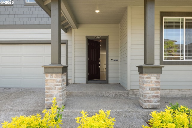 16648 SW Colorado Ln, Tigard, OR 97224 - doorway to property featuring a porch and a garage