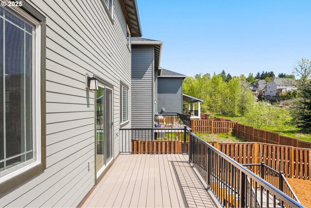 deck with a fenced backyard