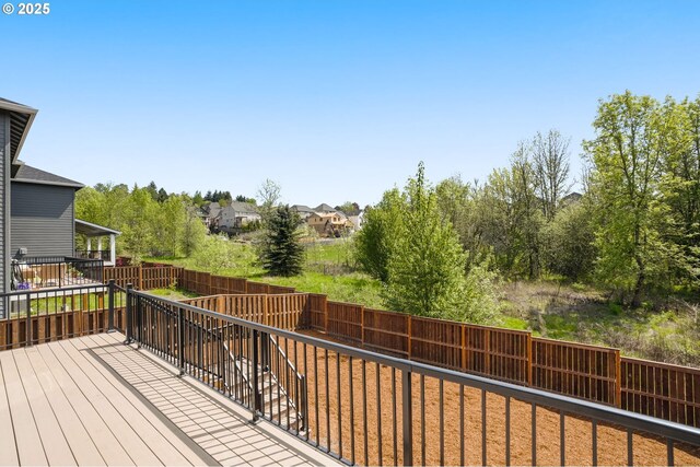 deck with a fenced backyard