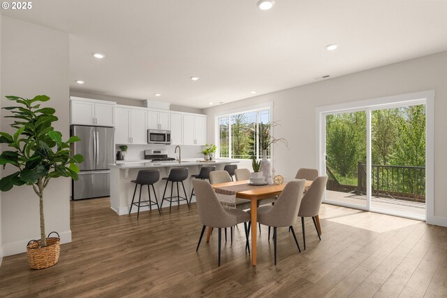 dining area featuring recessed lighting, wood finished floors, and visible vents