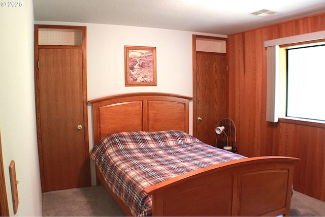 924 Lou Gray Dr, Myrtle Creek, OR 97457 - carpeted bedroom with wood walls and visible vents