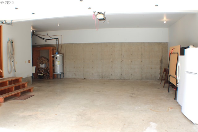 924 Lou Gray Dr, Myrtle Creek, OR 97457 - garage with strapped water heater and freestanding refrigerator