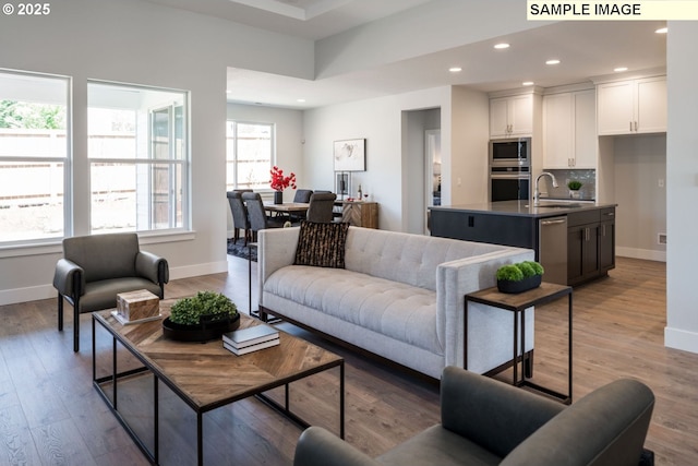 8119 N Hargrave St, Camas, WA 98607 - living area with baseboards, wood finished floors, and recessed lighting