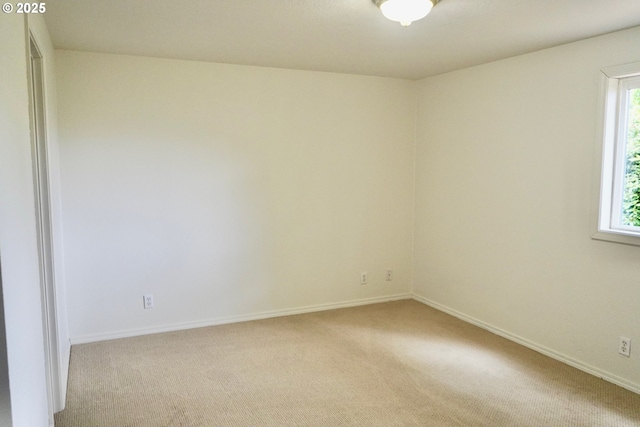 1680 22nd St, Florence, OR 97439 - unfurnished room featuring light carpet and baseboards