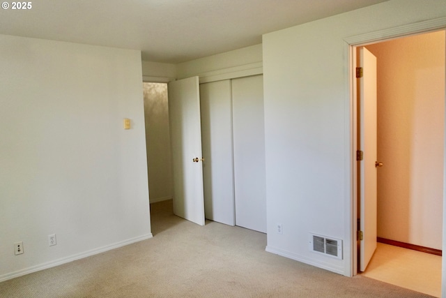 1680 22nd St, Florence, OR 97439 - unfurnished bedroom featuring light colored carpet and a closet