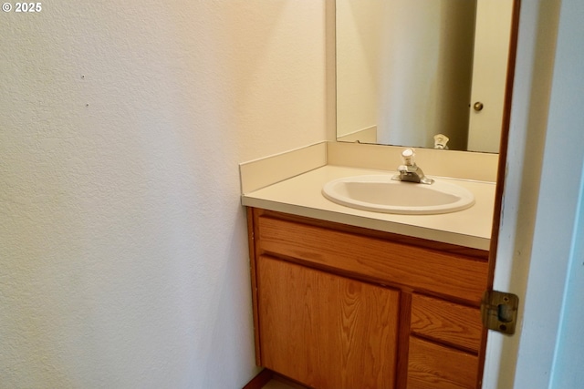 1680 22nd St, Florence, OR 97439 - bathroom with vanity and a textured wall