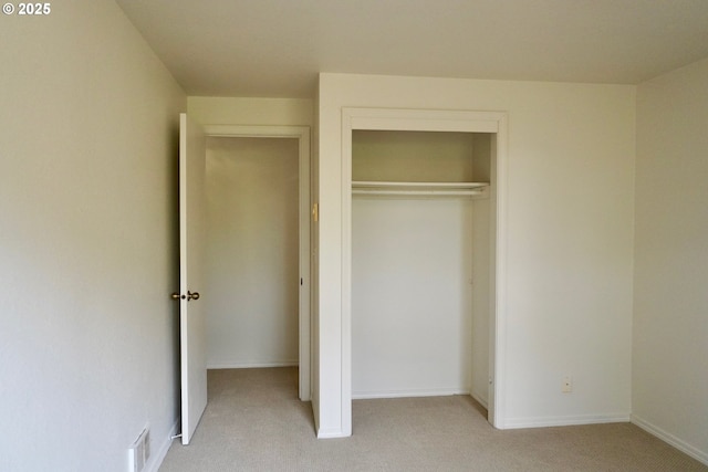 1680 22nd St, Florence, OR 97439 - unfurnished bedroom featuring light carpet and a closet