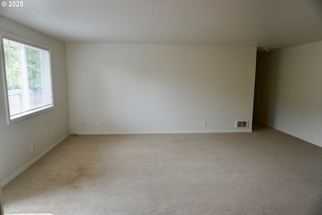 1680 22nd St, Florence, OR 97439 - empty room with light colored carpet and baseboards