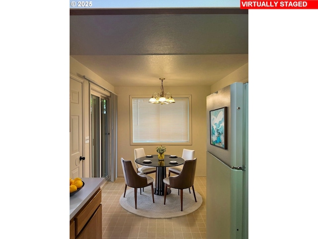 1680 22nd St, Florence, OR 97439 - dining room with a chandelier and baseboards
