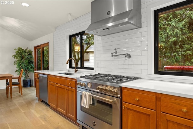 3520 Red Cedar Way, Lake Oswego, OR 97035 - kitchen featuring stainless steel appliances, range hood, light countertops, decorative backsplash, and lofted ceiling