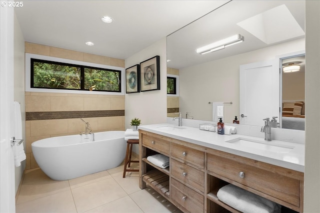 3520 Red Cedar Way, Lake Oswego, OR 97035 - full bathroom featuring tile walls, double vanity, a freestanding tub, tile patterned flooring, and recessed lighting