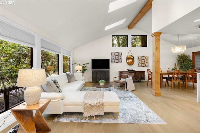3520 Red Cedar Way, Lake Oswego, OR 97035 - living room featuring high vaulted ceiling, healthy amount of natural light, beamed ceiling, wood finished floors, and a skylight