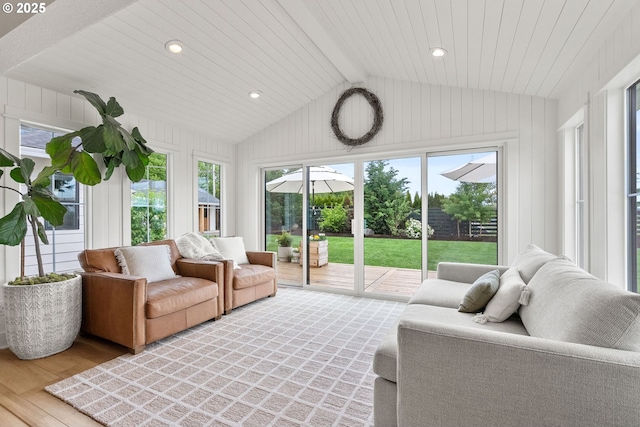 sunroom / solarium with beamed ceiling and outdoor lounge area