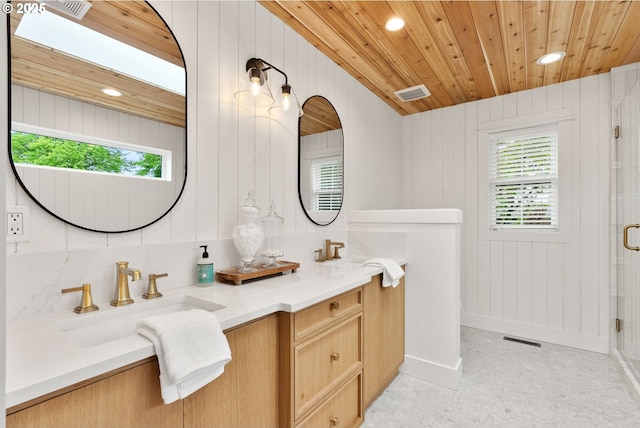 bathroom featuring recessed lighting, visible vents, wooden ceiling, and a sink