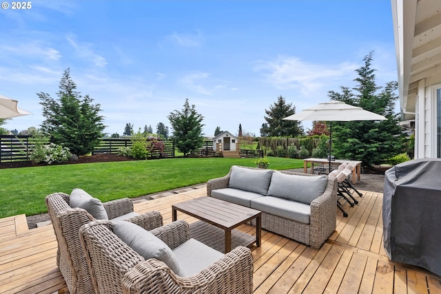 wooden terrace featuring a lawn, fence private yard, and an outdoor hangout area