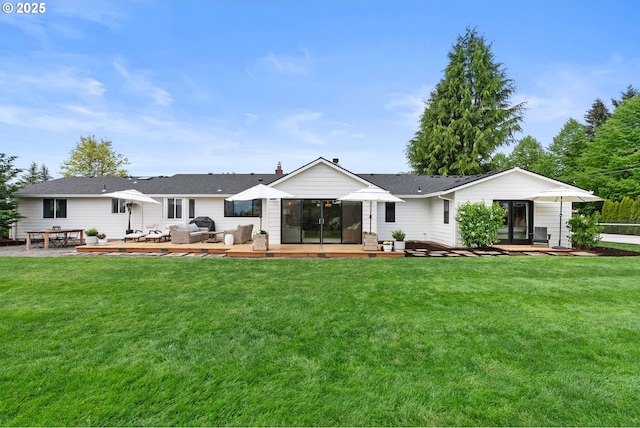 rear view of house with an outdoor living space, a yard, and a deck