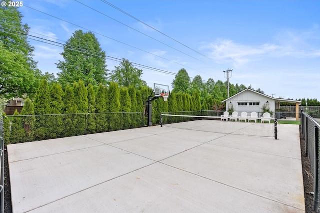 view of patio with fence and community basketball court