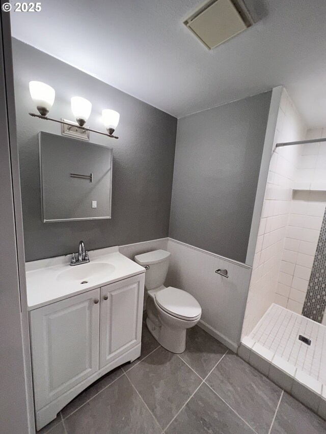 891 NE Bunyard Pl, Estacada, OR 97023 - full bathroom with a stall shower, vanity, toilet, and tile patterned floors