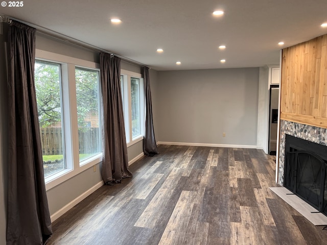 891 NE Bunyard Pl, Estacada, OR 97023 - unfurnished living room with recessed lighting, dark wood-type flooring, a fireplace, and baseboards