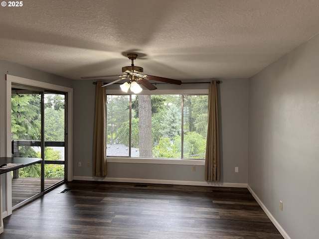 891 NE Bunyard Pl, Estacada, OR 97023 - spare room featuring ceiling fan, plenty of natural light, dark wood-style floors, and a textured ceiling