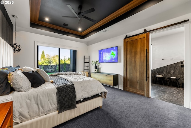 NE 43rd Cir Lot 5, Camas, WA 98607 - bedroom featuring a barn door, ornamental molding, access to outside, dark carpet, and a raised ceiling